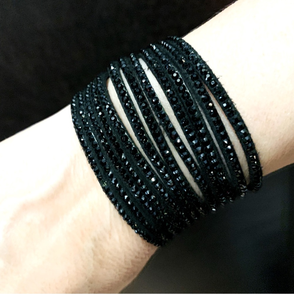 Black suede cuff style bracelet with sparkling black beaded strings adjustable